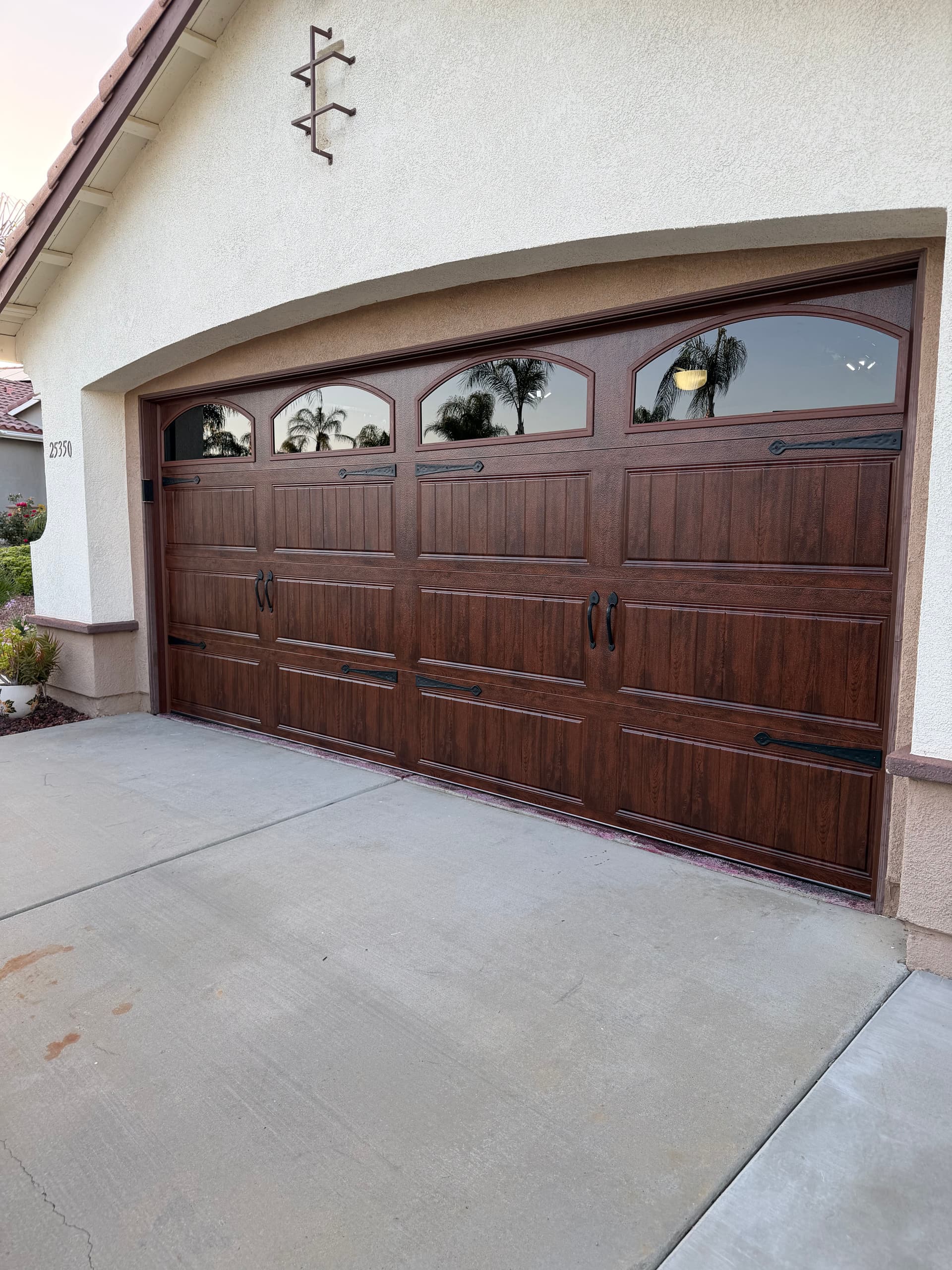 Clopay Gallery Walnut Garage Door with Arched Windows image