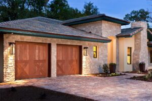 A beautiful home with two wood garage doors